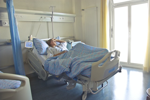person resting in hospital bed