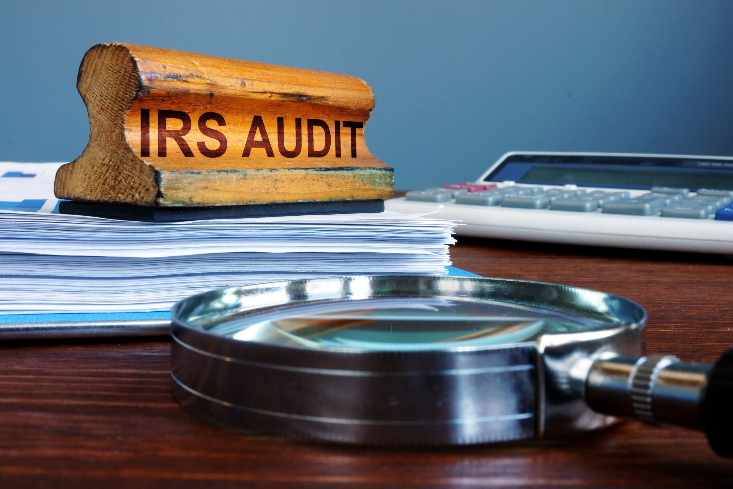 Stamp IRS audit and accounting documents.