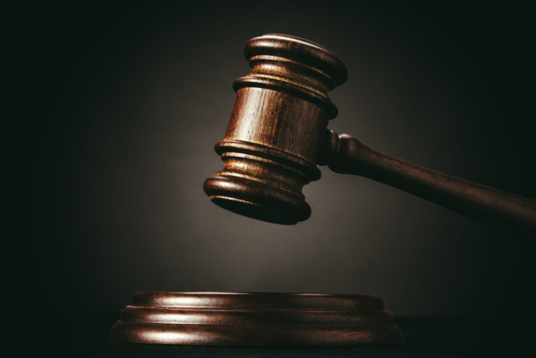 Judge gavel on a black background