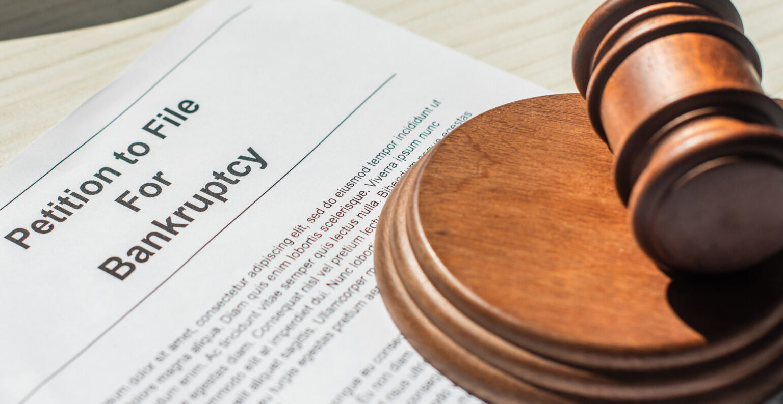 Petition for bankruptcy with wooden block and gavel on white textured background, banner